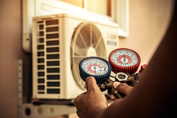 Professional Air Conditioning Service technician working in Waban, MA